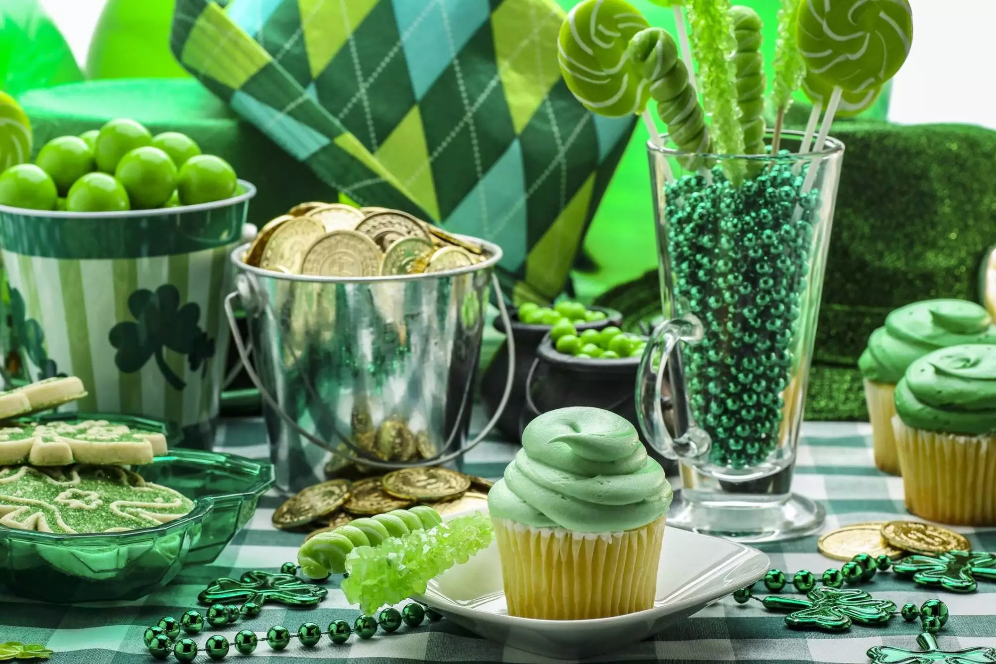 This is a bright and colorful green photograph of St Patrick's day party favors and food